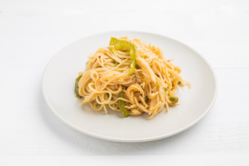 Noodles with bell pepper on plate
