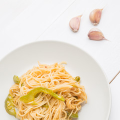 Noodles with bell pepper on plate
