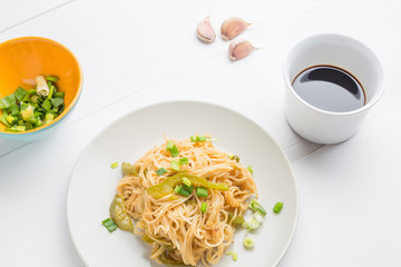 Noodles with bell pepper on plate