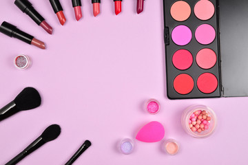 Professional makeup products with cosmetic beauty products, blushes, eye liner, eye lashes, brushes and tools.