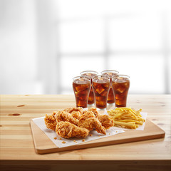 crispy coated batter southern style fried chicken in a wooden table