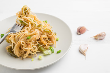 Closeup Spaghetti with chili, garlic,holy basil,olive oil and smoked chicken breast. East meets West.