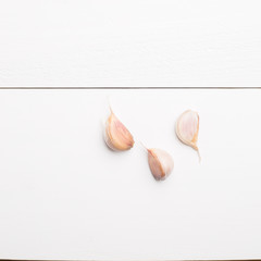 Garlic cloves on wooden background
