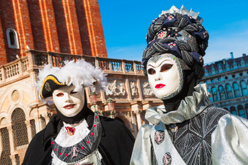 Obraz na płótnie Canvas People wearing venitian carnival mask during Venice carnival in Italy