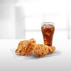 crispy coated batter southern style fried chicken in a wooden table