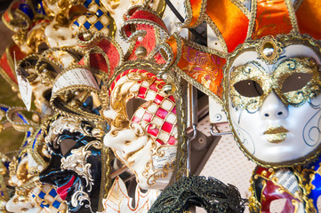 Person wearing venitian carnival mask during Venice carnival in Italy