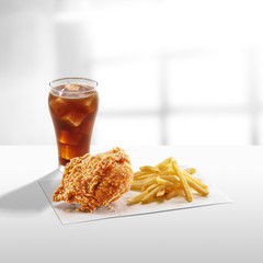 crispy coated batter southern style fried chicken in a wooden table