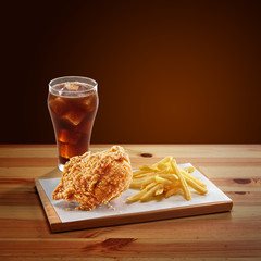 crispy coated batter southern style fried chicken in a wooden table
