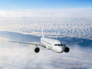 airplane flying over clouds.