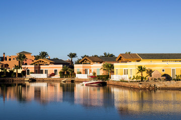 Fototapeta na wymiar Houses near the water on the canal in El Gouna, Egypt.