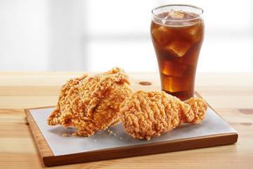 crispy coated batter southern style fried chicken in a wooden table