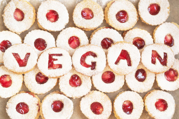 Homemade christmas cookies with vegan lettering - traditional 