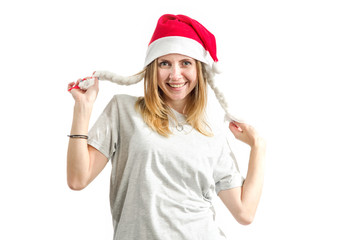 Young woman in red santa claus hat isolated on white background. Christmas mood.