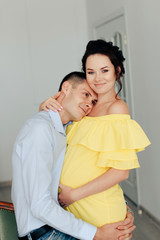 Fototapeta premium young married couple waiting for a miracle, pregnant wife with her husband