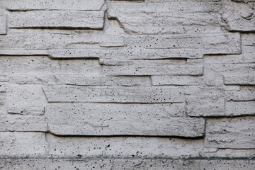 the texture of gray stone masonry wall