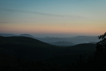 Mist between the mountains at sunset