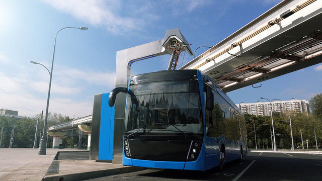 Blue electric bus at the charging station.Modern trains on the monorail.