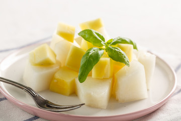 fruit salad. Mango and melon with Basil