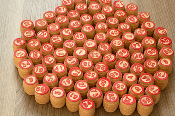 On a wooden table lie kegs of lotto without a bag