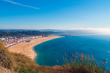 From the high point of the Nazare we can see the beach the sea and the village Nazare, Portugal