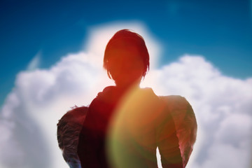 Silhouette of a white and dark side of angel as symbol of the ambivalence of human nature (the...