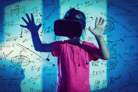 Composite image of geometric shape with formulas against schoolgirl using virtual reality headset