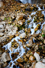 beautiful waterfall in forest, autumn landscape.