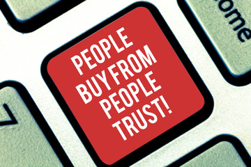 Fototapeta premium Handwriting text writing People Buy From People They Trust. Concept meaning Building trust and customer satisfaction Keyboard key Intention to create computer message pressing keypad idea
