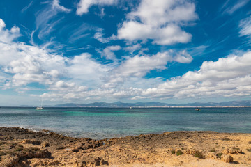 Sail boat in the paradise of blue waters of the wonderful sea in a beautiful place in the ocean