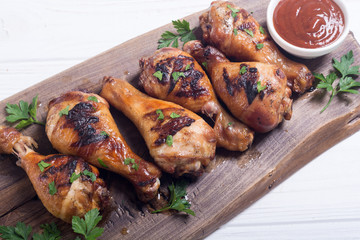 Grilled chicken legs with tomato sauce BBQ food background