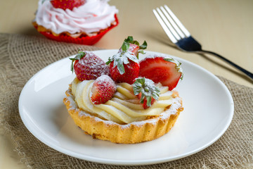 Tasty strawberry cream cake. Pastry. Sweet dessert on a plate