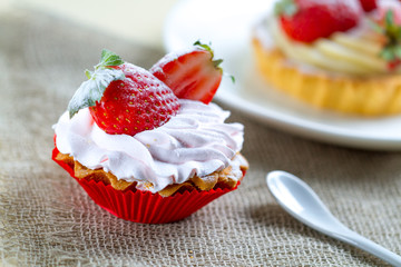 Tasty strawberry cake with cream and fresh strawberries. Pastry. Sweet dessert