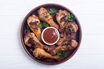 Grilled chicken legs with tomato sauce BBQ food background
