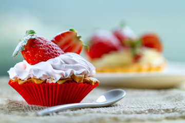 Tasty strawberry cake with cream and fresh strawberries. Pastry. Sweet dessert