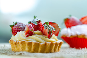 Tasty strawberry cake with whipped cream and with fresh strawberries. Pastry. Sweet dessert