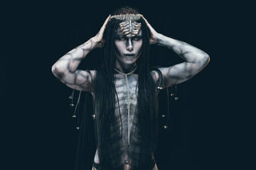 A young woman in the image of a humanoid and extraterrestrial alien.