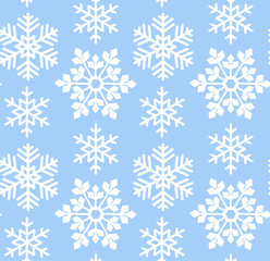 Fototapeta na wymiar Blue abstract seamless pattern with white beautiful snowflakes.