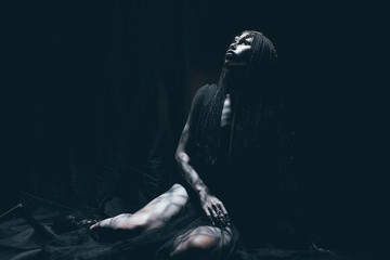 A young woman in the image of a humanoid and extraterrestrial alien.