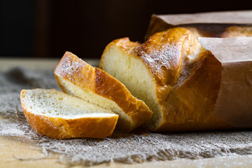 Long loaf from the bakery on the table. Bakery products. Bread from rye, wheat flour