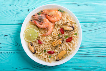 Instant noodles soup with shrimps and mssels . Asian food