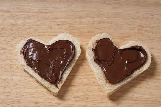 two heart shaped bread slices with chocolate spread as Valentines day concept                        