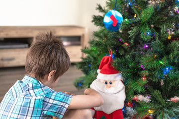 Child making a wish at Santa Claus
