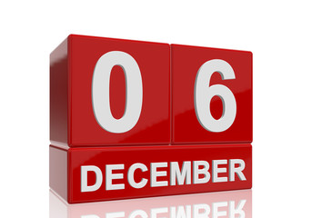 The date of 6 December in white numbers and letters on red, glossy blocks, standing and mirrored isolated in front of a white background.