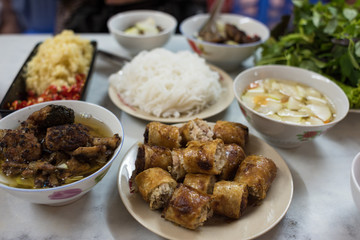 Traditional Vietnamese Bun Cha meal with soup, meat and fried springrolls