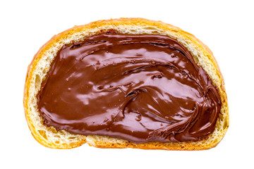 Isolated piece of loaf with spread chocolate paste on a white background. Sweet, nut butter with fresh bread for breakfast.