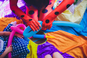 animator for children inflates long balls