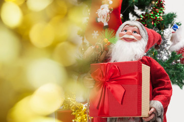 Santa Claus with gift box . Christmas and new year concept, with bokeh.