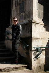 man in sunglasses on the background of architecture