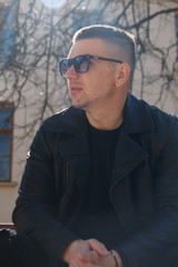 man in sunglasses on the background of architecture