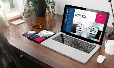 devices online school on wooden desktop